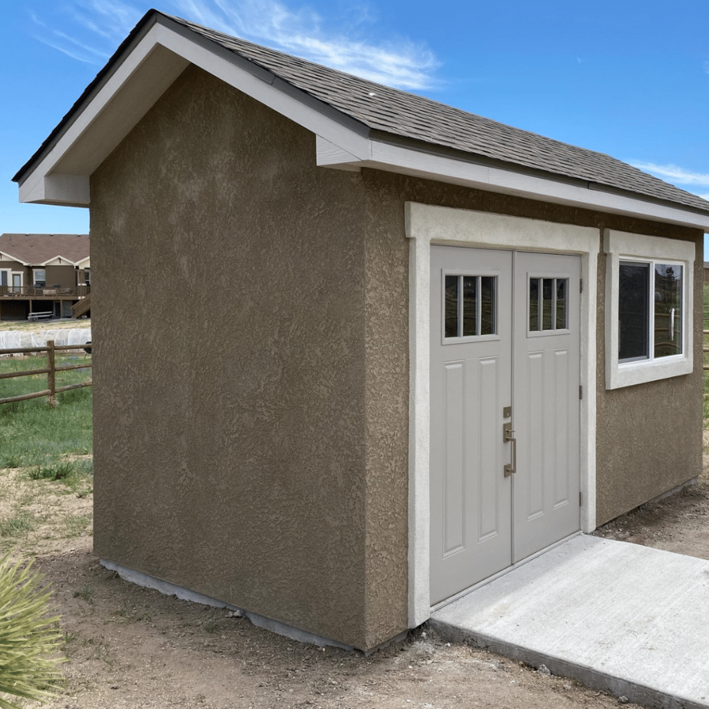 Custom Built Stucco Shed - Footprint Decks and Design proudly serves Colorado Springs, Monument, Castlerock, Denver, Peyton, and Black Forrest.